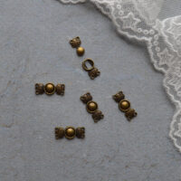 Застібка для лялькового одягу бронза 15*6мм 1шт FK026